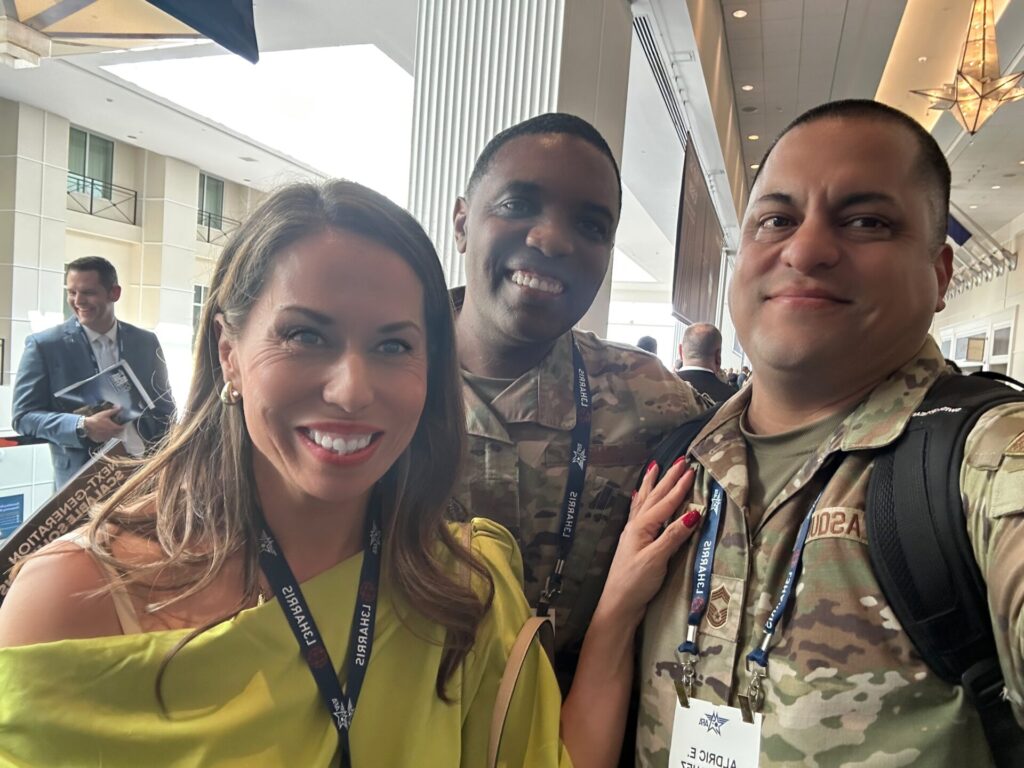WeVett's sles director poses with two military members during the AFAF 2025 conference